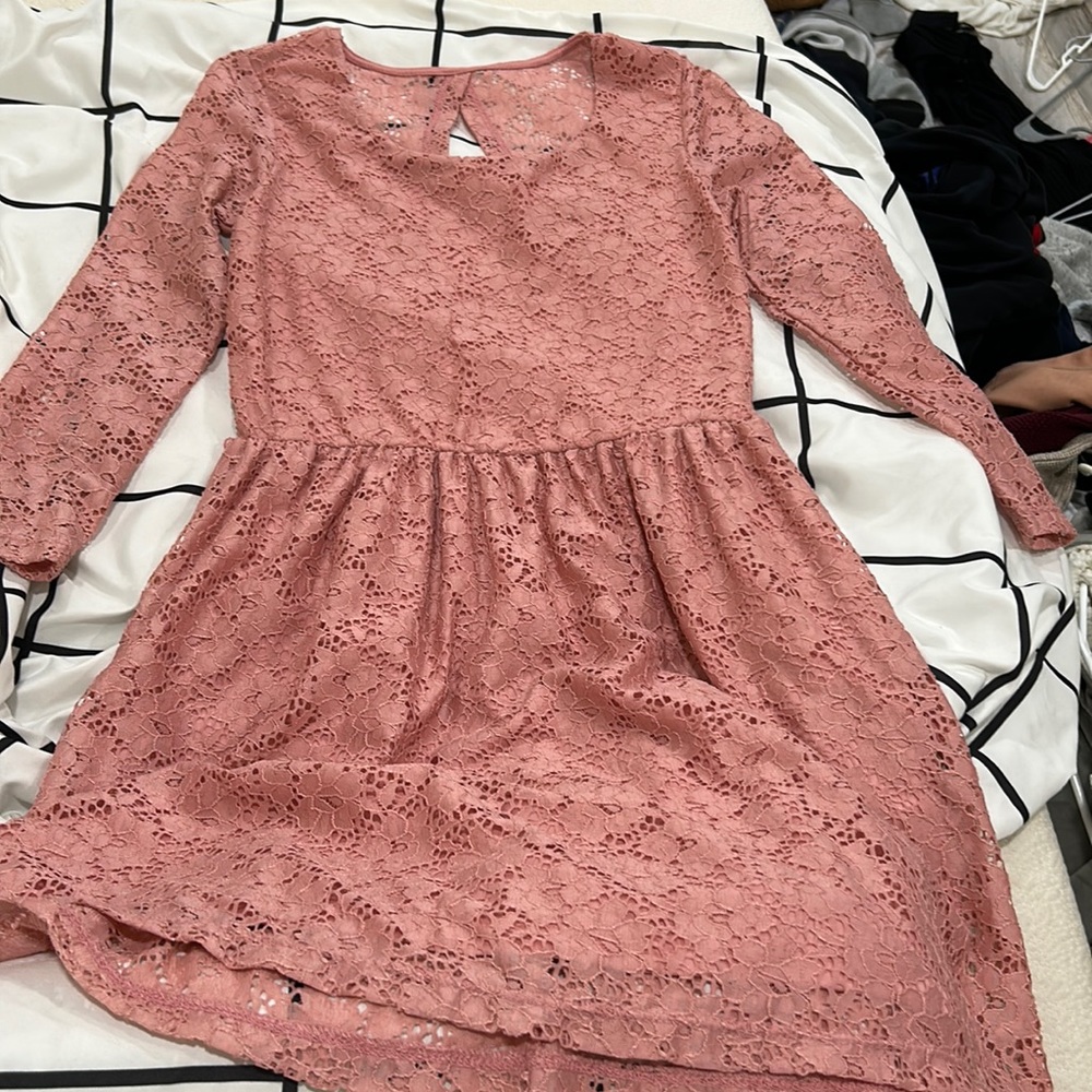 I’m selling a cute kids dress. The color is coral but more pink. It’s a small.